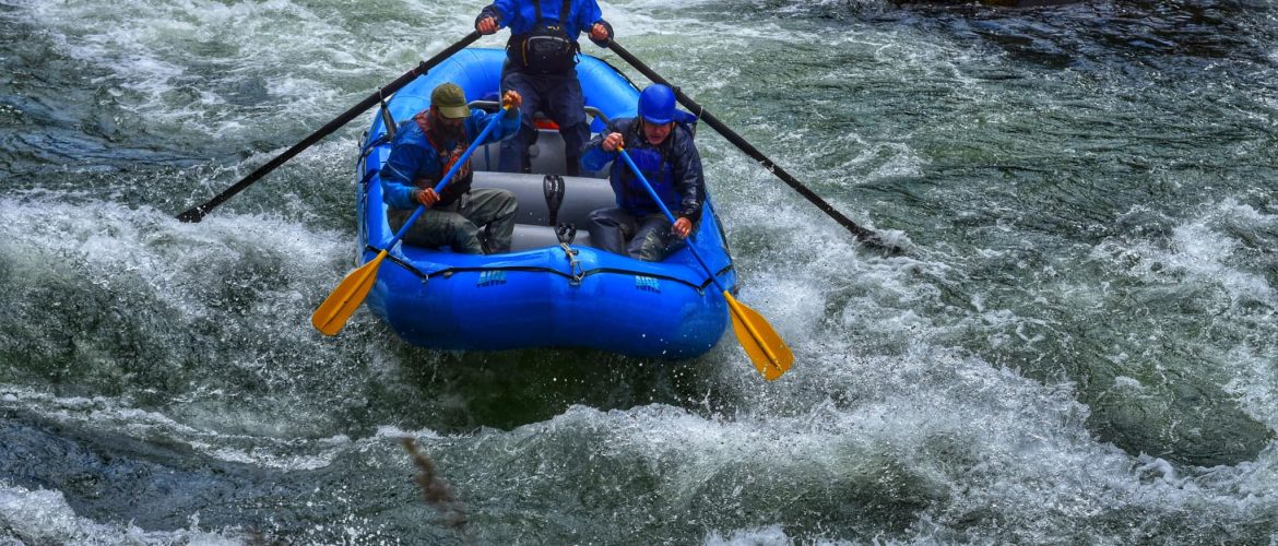 small group of winter rafters in a rapid