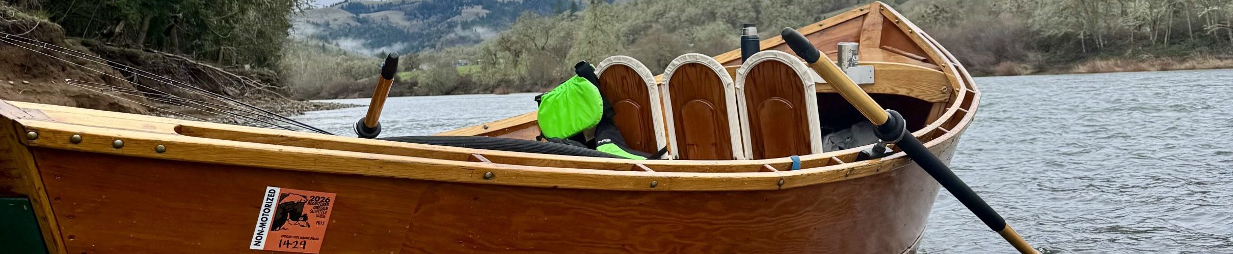 wooden drift boat on the banks of the North Umpqua River